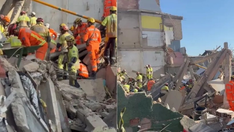 Imagem de socorristas trabalhando em uma cena de desabamento, com escombros e estrutura de prédios danificados ao fundo. Trabalhadores estão usando equipamentos de segurança e se movimentando entre os destroços.