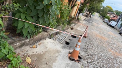 Rua Isauro Ferreira, no bairro Porto Velho, em Divinópolis, com reparos urgentes na drenagem