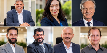 Montagem de retratos de sete profissionais em ambientes de escritório, todos vestindo roupas formais, sorrindo e olhando para a câmera.